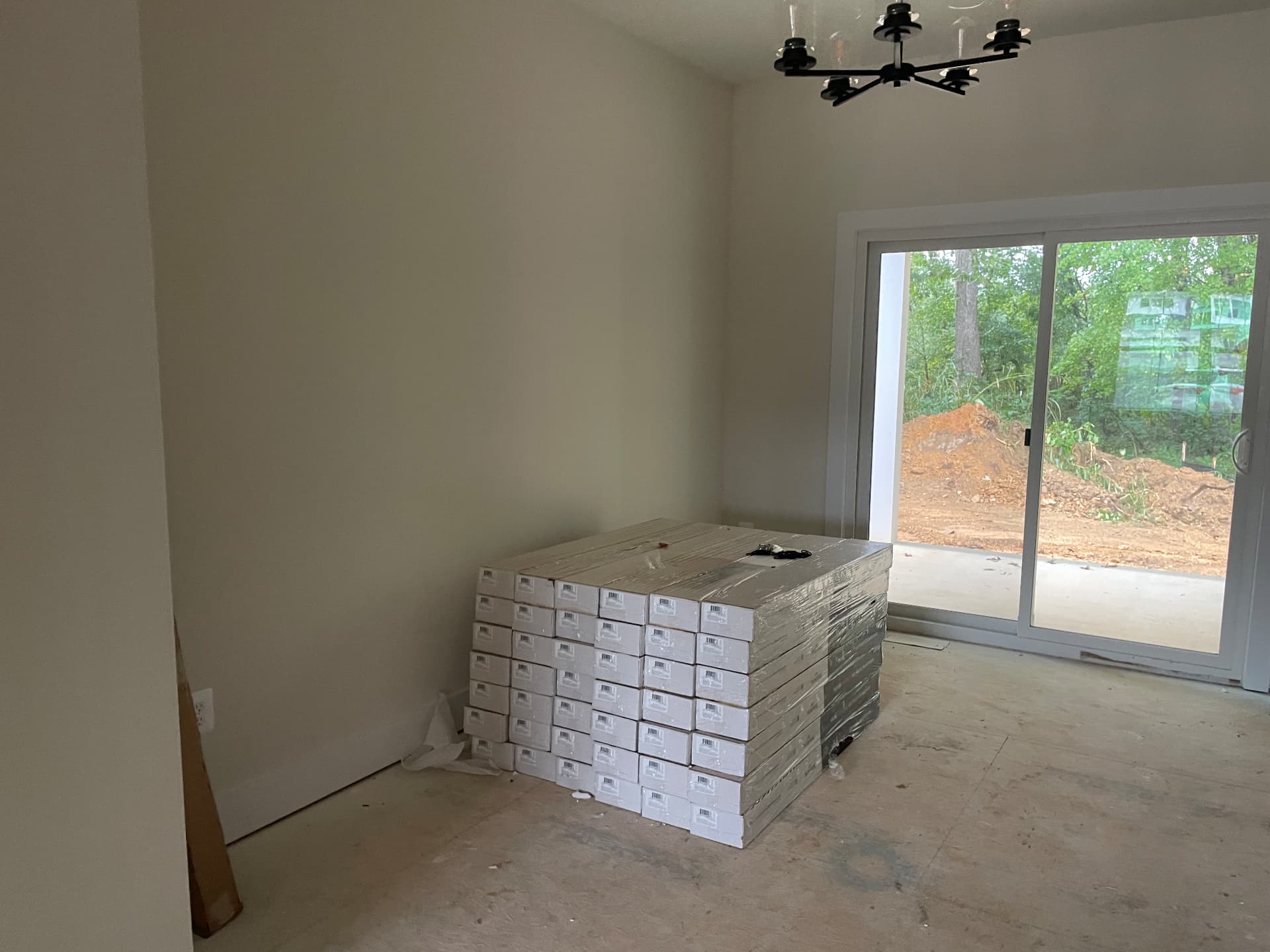 Flooring delivered and staged in a room at 8005 Sherbeyn Road